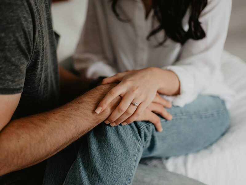 woman holding man s hand